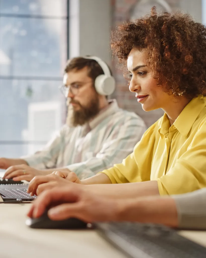 Woman in yellow at computer